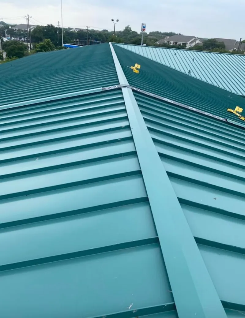 Green commercial metal roof ridge and valley for Metal Roof Repair in Marshfield